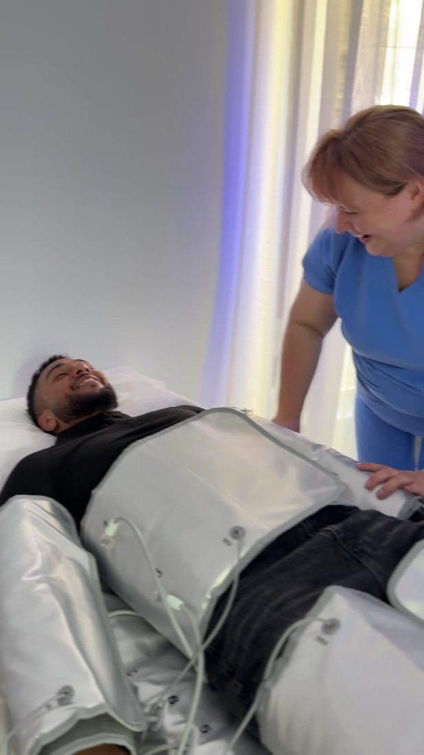 A client relaxing during pressotherapy at Cosmetic Medicine