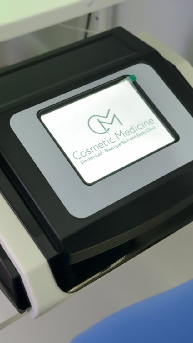 The pressotherapy machine screen showing the Cosmetic Medicine logo